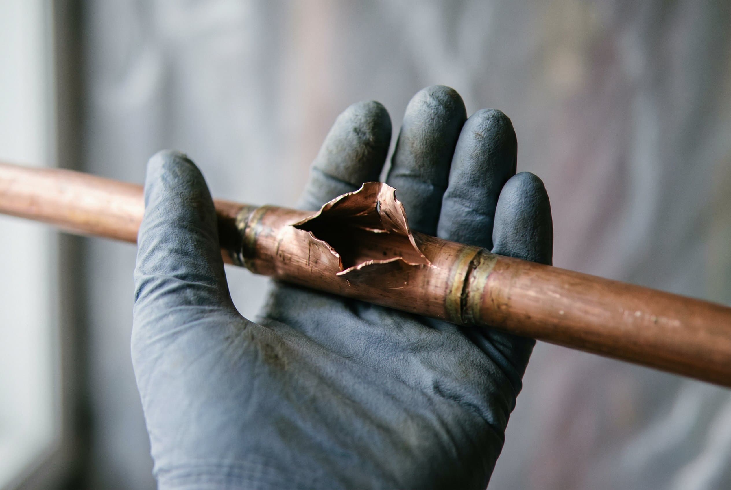 Fractured copper pipe at joint.
