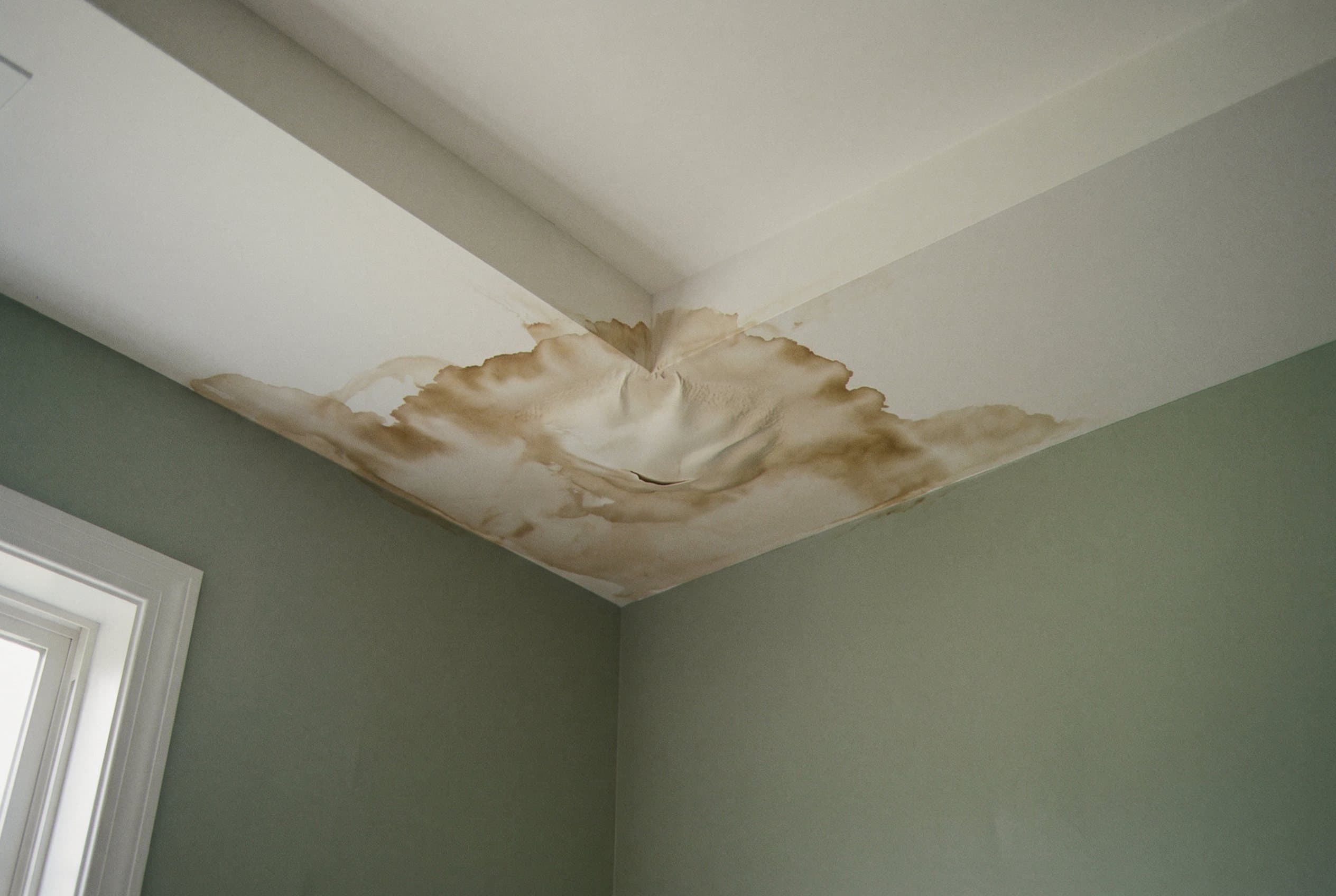 Ceiling water stain from hidden leak.